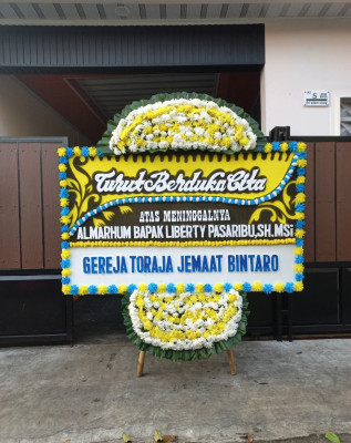 Papan Bunga Duka di Asam